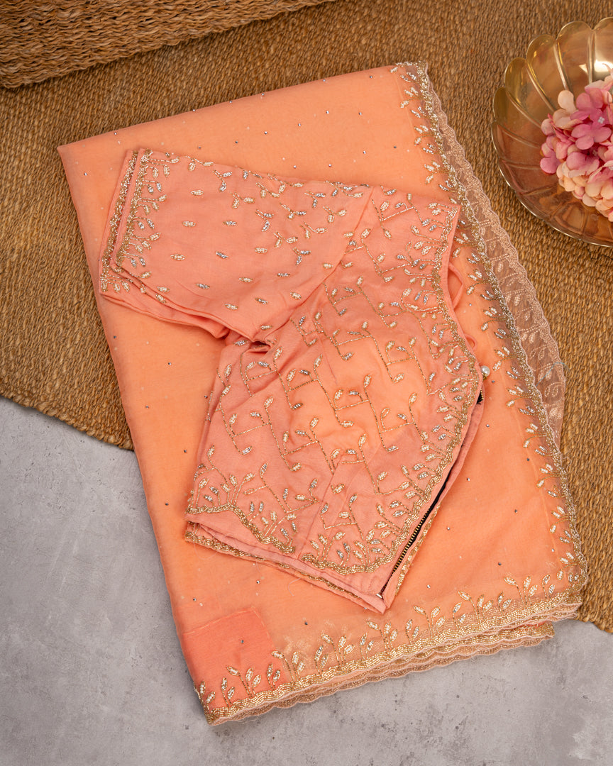 Pastel Peach Partywear Pure Orgaza Silk saree with Cutdana and Pearl Hand Embroidered Borders with Intricate Handwork Blouse