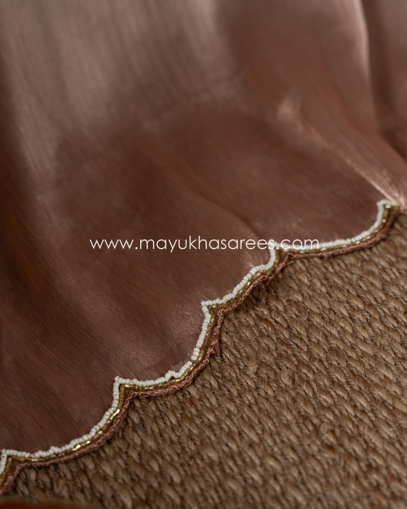 Mauve Shimmer Organza Saree With Hand Worked Borders And Beige Striped Blouse