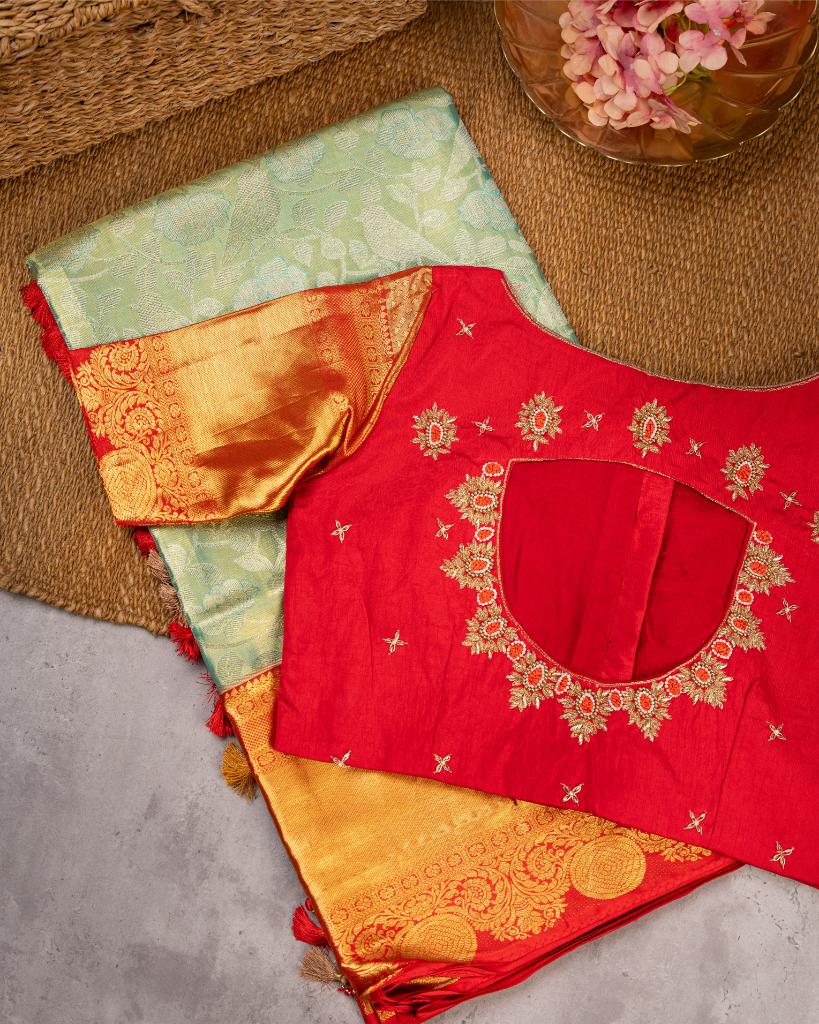 Exclusive Tissue Kanchipuram in Pastel Green with all over Parrots weaving and Red Borders & Hand Embroidered Blouse | Blouse Size 38-44” | Free Shipping