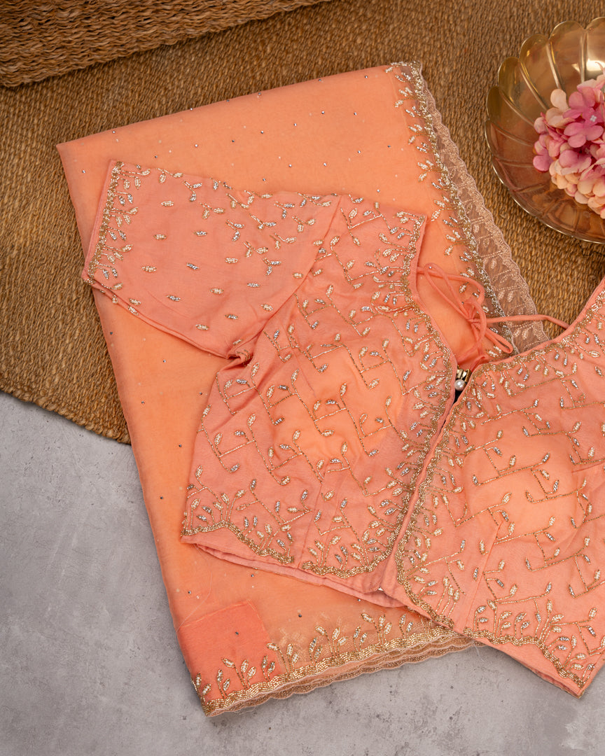Pastel Peach Partywear Pure Orgaza Silk saree with Cutdana and Pearl Hand Embroidered Borders with Intricate Handwork Blouse