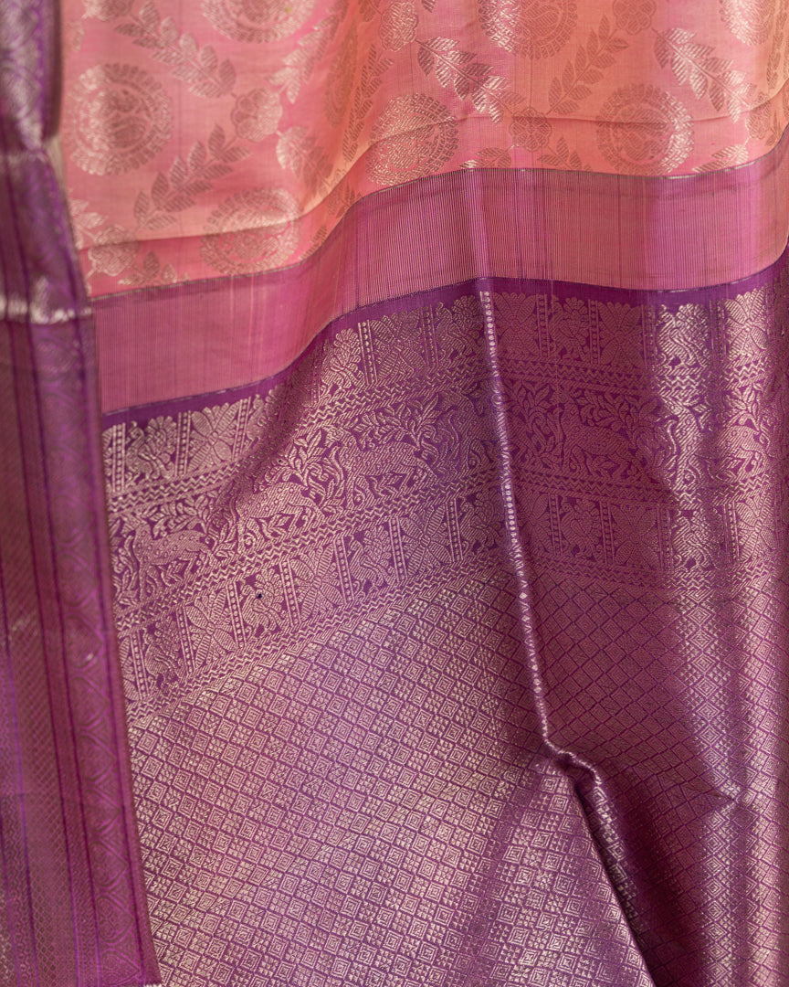 Pastel Peach Kanchipuram Silk Saree with all over Jangla Weaving and Silver borders & Elegant Hand work Purple Blouse