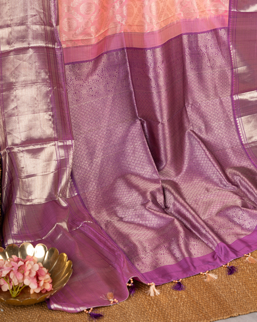 Pastel Peach Kanchipuram Silk Saree with all over Jangla Weaving and Silver borders & Elegant Hand work Purple Blouse