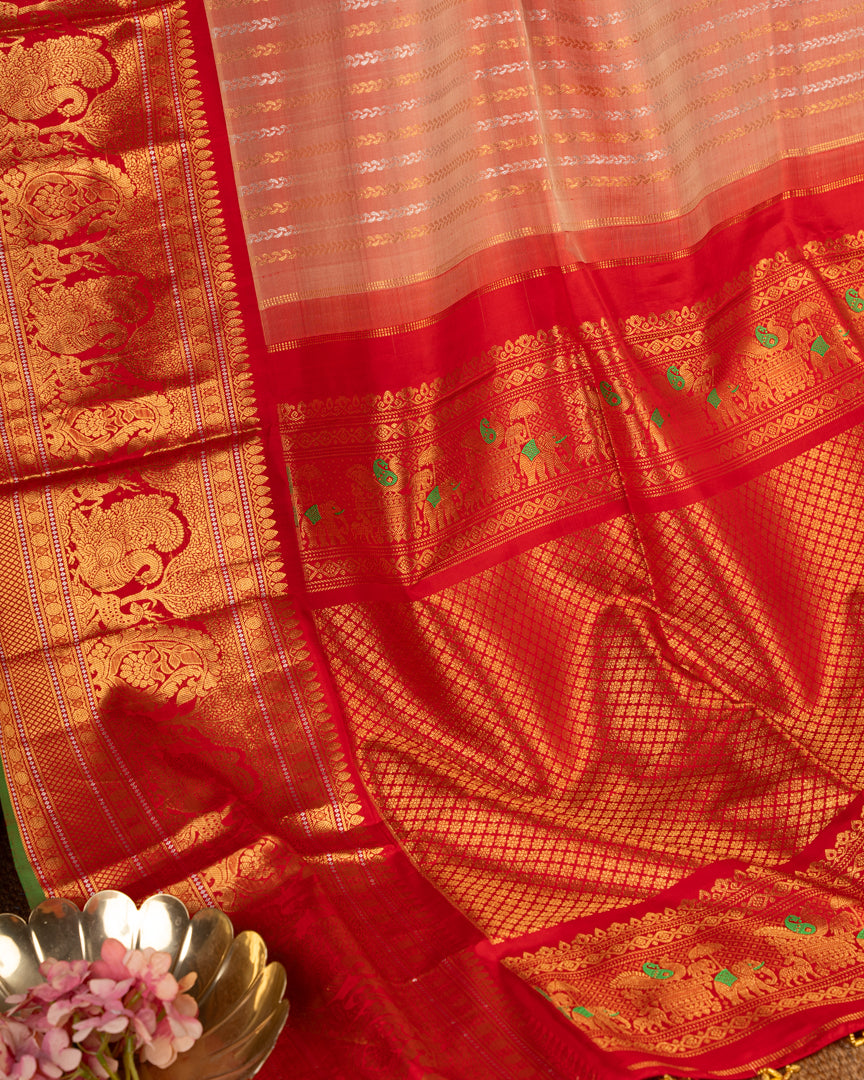 Pastel Peach Gadwal Brocade Silk saree with Red Kanchipuram Inspired Borders & Red Cutdana Handwork Blouse
