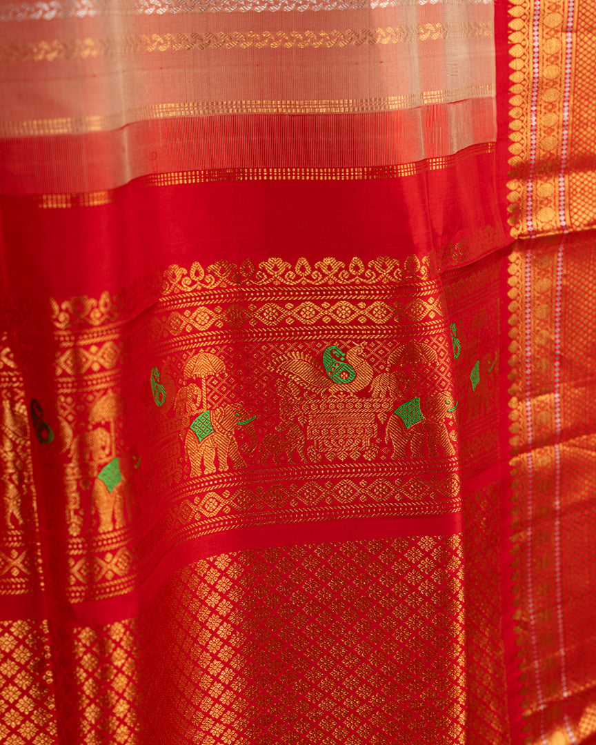 Pastel Peach Gadwal Brocade Silk saree with Red Kanchipuram Inspired Borders & Red Cutdana Handwork Blouse