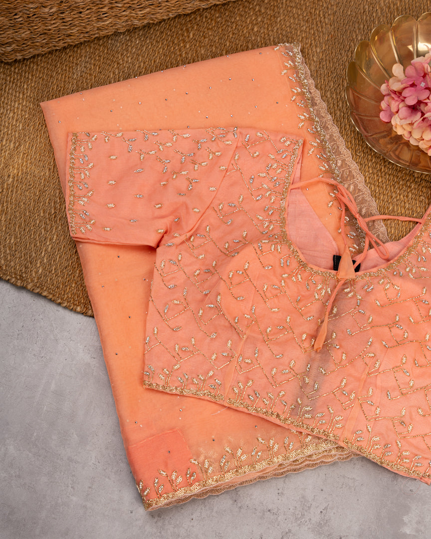 Pastel Peach Partywear Pure Orgaza Silk saree with Cutdana and Pearl Hand Embroidered Borders with Intricate Handwork Blouse