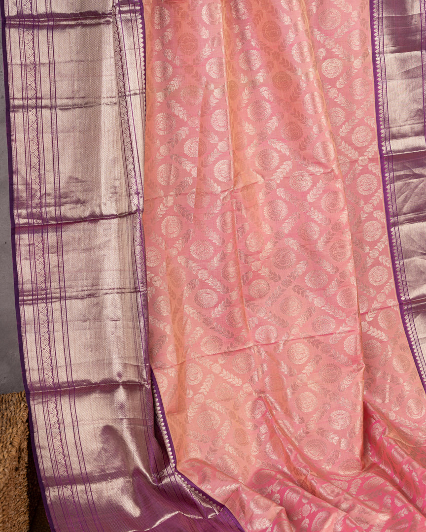Pastel Peach Kanchipuram Silk Saree with all over Jangla Weaving and Silver borders & Elegant Hand work Purple Blouse