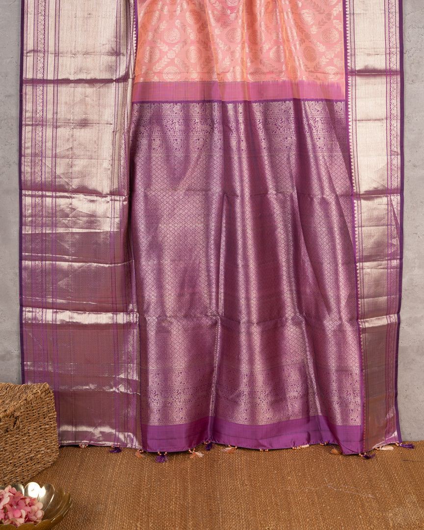 Pastel Peach Kanchipuram Silk Saree with all over Jangla Weaving and Silver borders & Elegant Hand work Purple Blouse